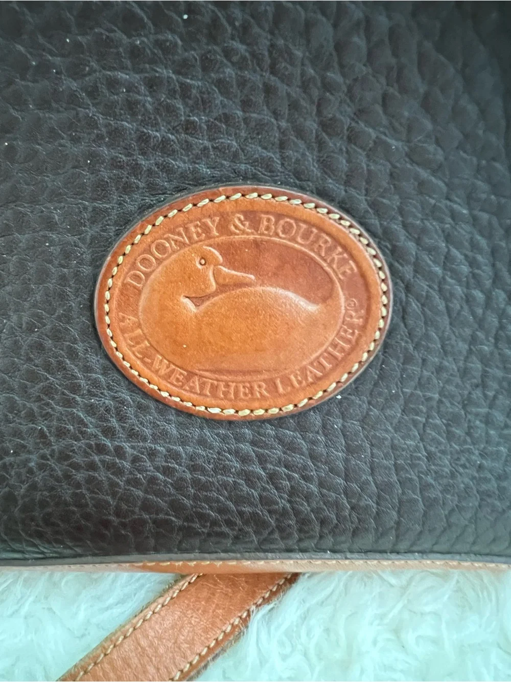 Dooney & Bourke VINTAGE black pebbled Leather satchel with British tan trim.